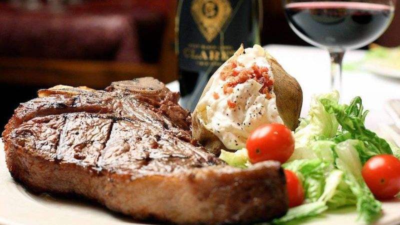Grilled steak, loaded baked potato and salad featured by Princeton Tourism for Prime Quarter Steakhouse.