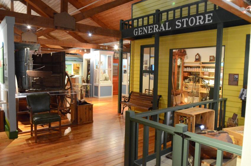 General store exhibit and historic wagon inside the Museum of the Grand Prairie in Mahomet.