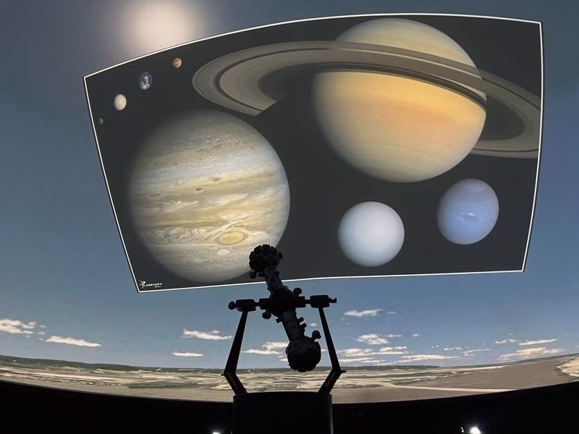 Planets projected on the dome above the star projector inside the Peoria Riverfront Museum planetarium.