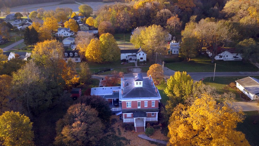 The Tiskilwa Inn amid autumn foliage.